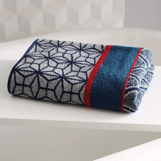 Serviette de bain en éponge jacquard – Douceur et élégance